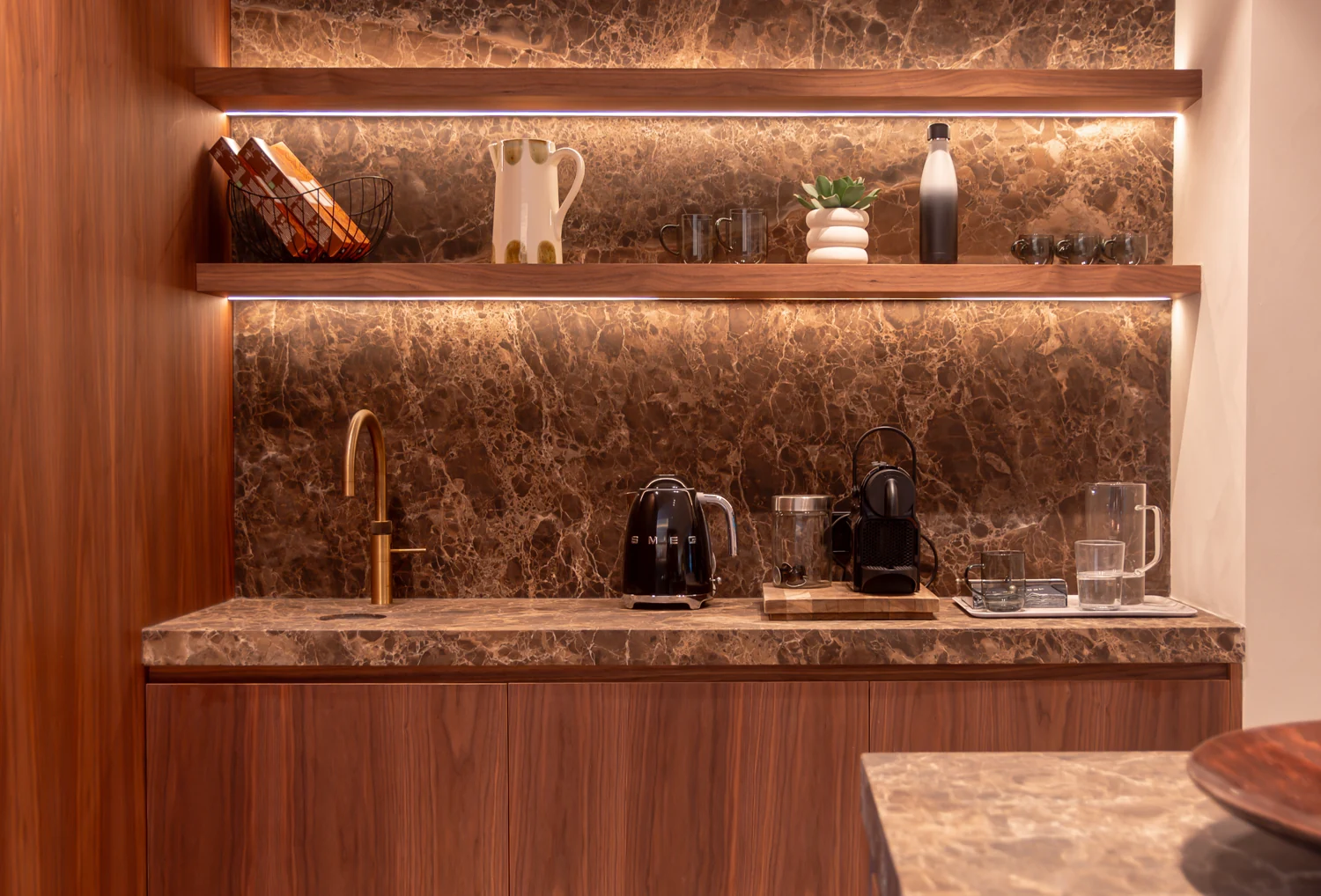 Illuminated shelving, stone and timber