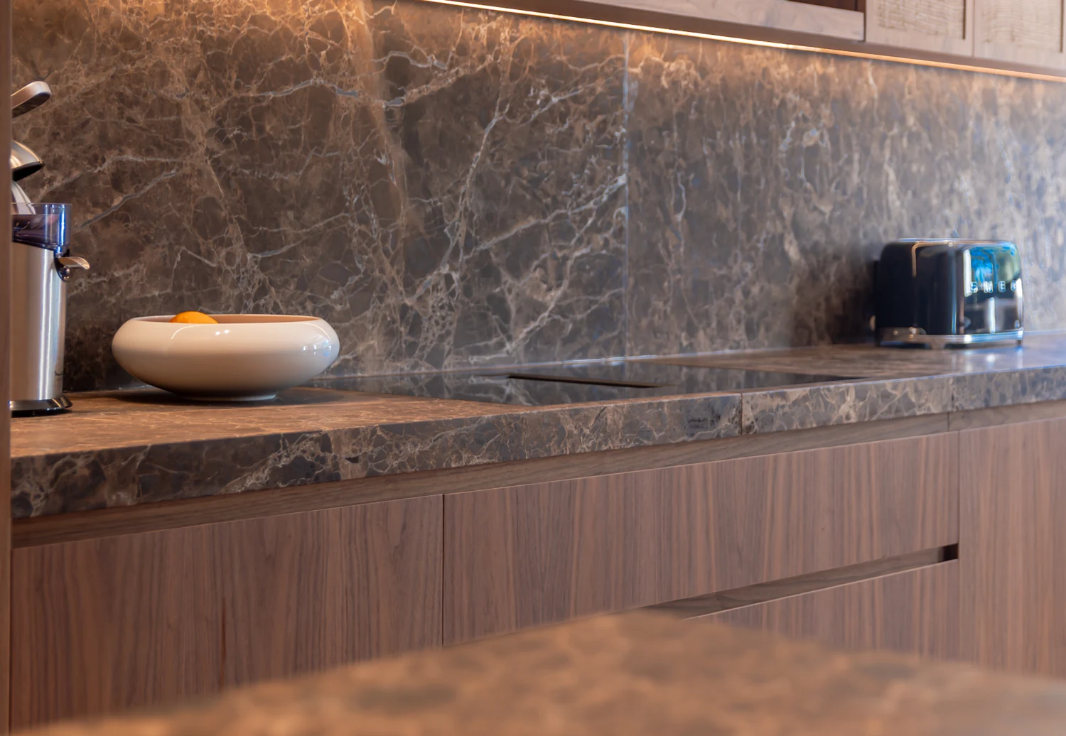 Stone worktops and warm wood grain