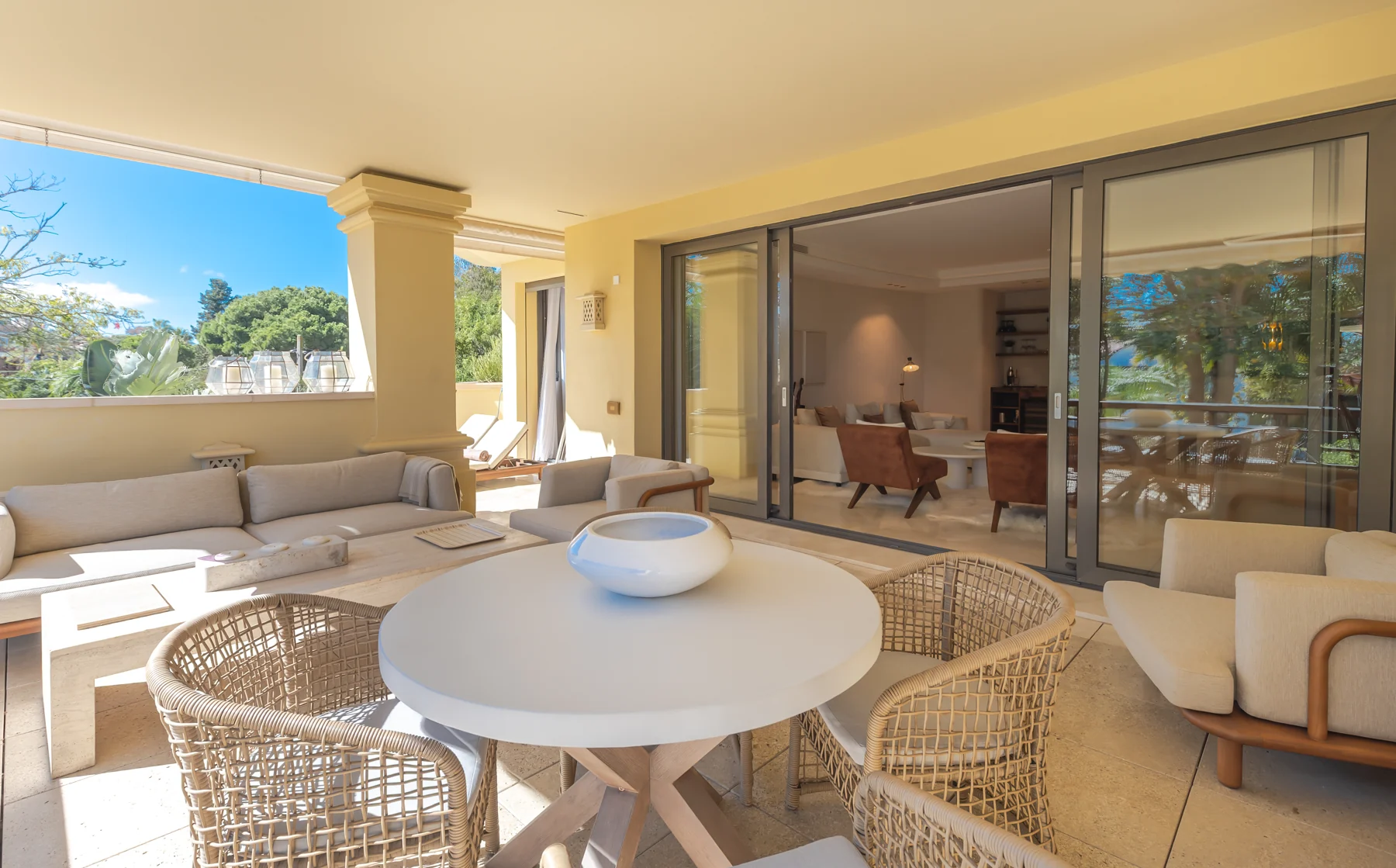 The apartment’s covered terrace with lounge and dining areas